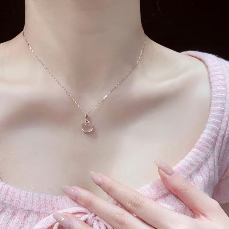 The Rosé Oval Pendant — close-up detail